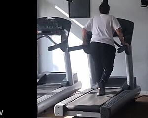 big booty girl walks on treadmill at gym
