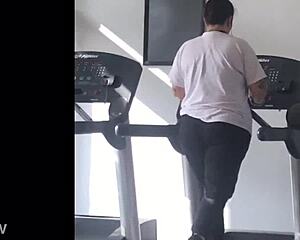 big booty girl walks on treadmill at gym