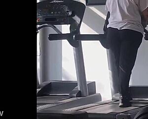 big booty girl walks on treadmill at gym