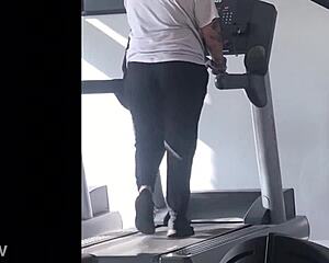 big booty girl walks on treadmill at gym