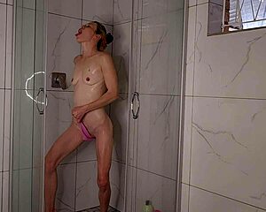 Hot MILF jerks off in the shower until she comes
