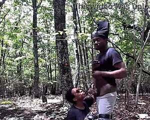 Submissive licks ass and deep throats cock in forest with spitting and gagging