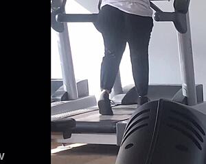 big booty girl walks on treadmill at gym