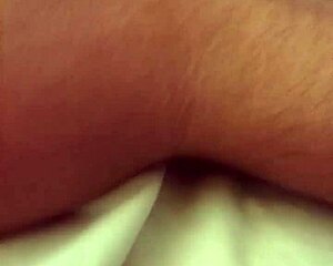 The handsome Brazilian guy lies down stroking his huge cock.