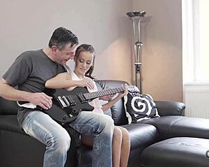Old Guitarist Lets Young Czech Fan Handle His Thick Instrument