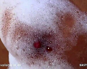 She enjoys a titty fuck before getting anally plowed in doggystyle position.