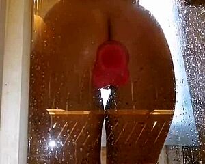 girl with a juicy ass plays naughty in the shower with her pink toy