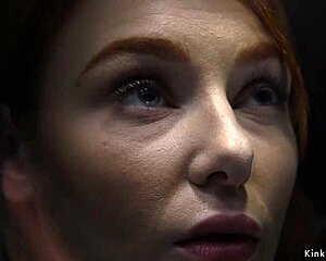 redhead experiences whipping on bondage device