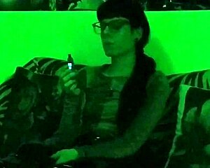 Look at Beth, the sexy goth domina, smoking in green light HD