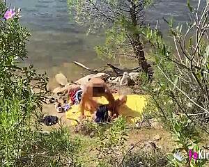 Outdoor fun unfolds as Noa rides a guy by the lake