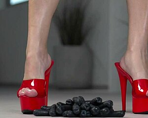 This 4K footfetish video features crushing fruits with bare feet and high heels