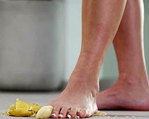 This 4K footfetish video features crushing fruits with bare feet and high heels