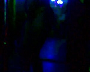 ebony woman performs striptease in public outdoor setting