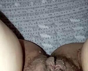A milf with her hairy pussy open and ready