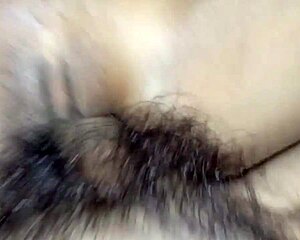 A young woman chats casually with a guy in a private setting