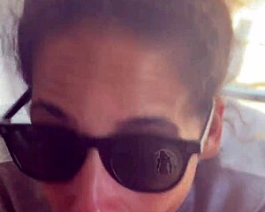 Lightskin ebony girl gives blowjob in front of window while boyfriend searches