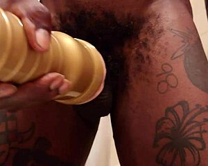 hallelujah johnson, the muscular bodybuilder pornstar, uses her gold fleshlight on a big black cock in this slave sex scene
