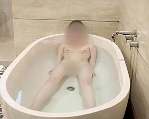 The beautiful Japanese college student bathes in a fetish scene