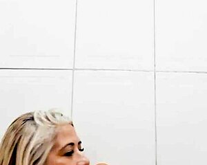 Blonde Milf Inserts Dildo Deep in Bathroom Pussy