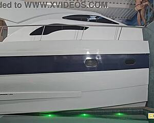 enjoying a fun boat ride with a blonde friend in see-through outfits