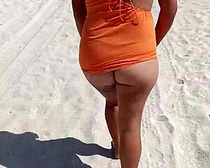 Whoa, check this horny Mexican puta flashing her thong and natural tits on a public beach 😈