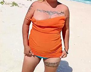 Whoa, check this horny Mexican puta flashing her thong and natural tits on a public beach 😈