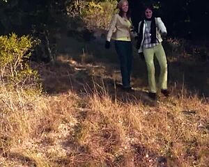 Brunette friends turn picnic into strapon lesbian sex