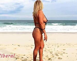 I'm showing off in micro bikini to guys on rio beach