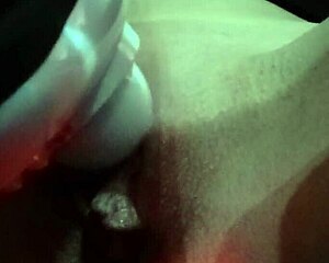 The vibrator massages the shaved pussy, making it wet during masturbation session