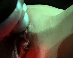 The vibrator massages the shaved pussy, making it wet during masturbation session