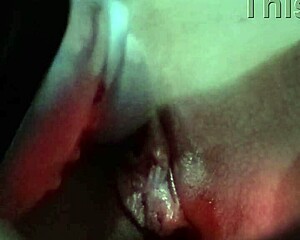 The vibrator massages the shaved pussy, making it wet during masturbation session