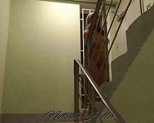 Young blonde flashes her trimmed pussy during naked walk in entrance