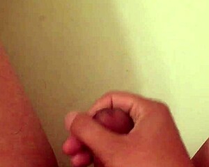 guy wanks in bathtub pool setting