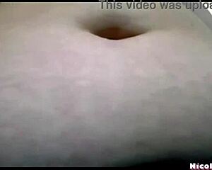 chubby amateur grabs her belly for playful interaction in bedroom