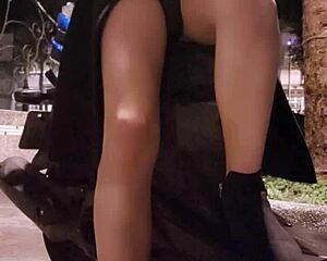 Shemale Ting Xuan hides underwear under coat while masturbating on street.