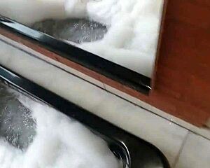 spying on brunette bathing, guy in dress joins and they interact