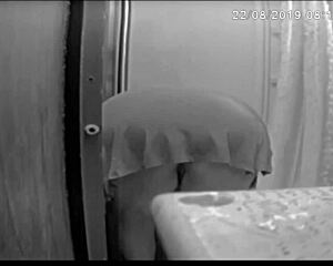 Jennifer Bent Over Washing The Shower In Bathroom