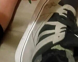 friend playfully trashes my sneakers with feet