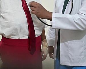 Indian doctor examines student patient in hospital setting.