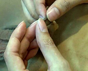 Asian ladyboy fingers her ass while stroking her tranny cock.