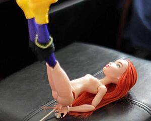 Batgirl doll gets tied up for massive cum shower drenching