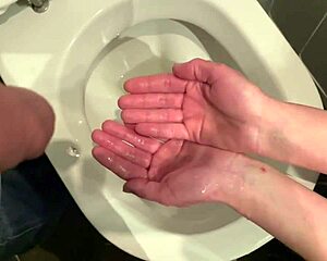 I grip his cock tight while he pees then wash hands in piss