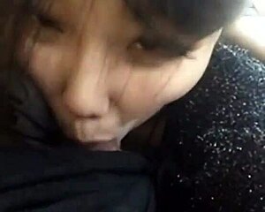 pretty chinese teen kneels down eagerly sucking hard cock in steamy blowjob scene