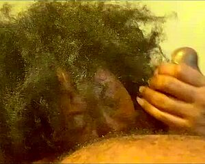 Ladyraex demonstrates deepthroat skills on big black dildo toy.