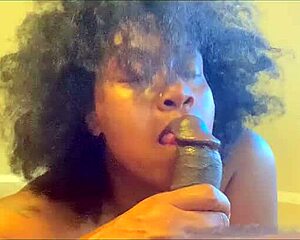 Ladyraex demonstrates deepthroat skills on big black dildo toy.