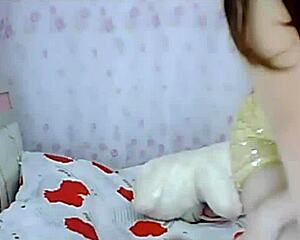 Asian amateur strips teases pussy solo in homemade bedroom video