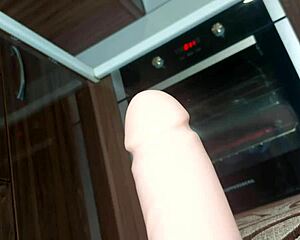 Muscular milf mommy straddles huge dildo fisting her hairy big pussy lips close-up moaning.