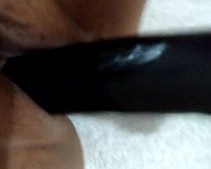 amateur wife bounces homemade toy in playful homemade scene