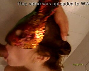 A husband and wife share a sensual early morning shower routine.