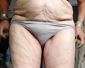 granny stuffs cucumber into her hairy spot